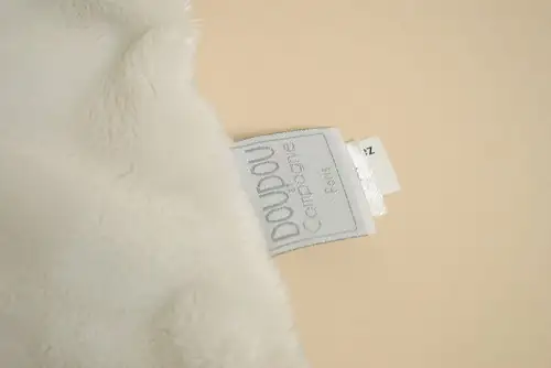 etiquette Doudou plat cigogne blanc verso vert à pois marque Doudou et Compagnie naissance oiseau