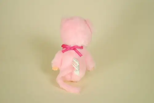 dos Peluche Monchhichi rose 19 cm fleurs de cerisier Sakura bavoir imprimé marque Sekiguchi doudou japonais