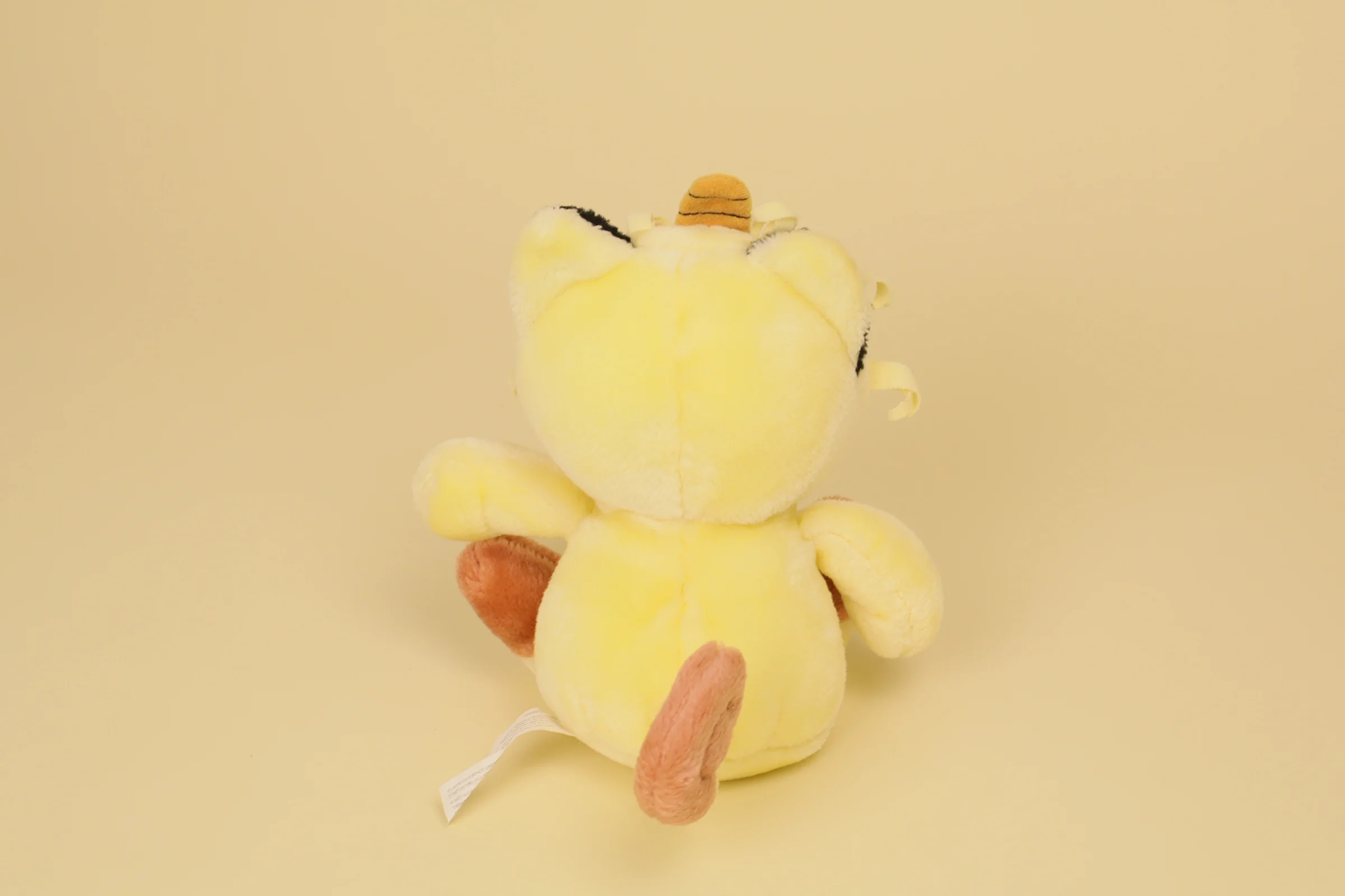 Dos Peluche Pokémon Miaouss vintage 1998 crème 23 cm marque Nintendo doudou rétro type normal Meowth
