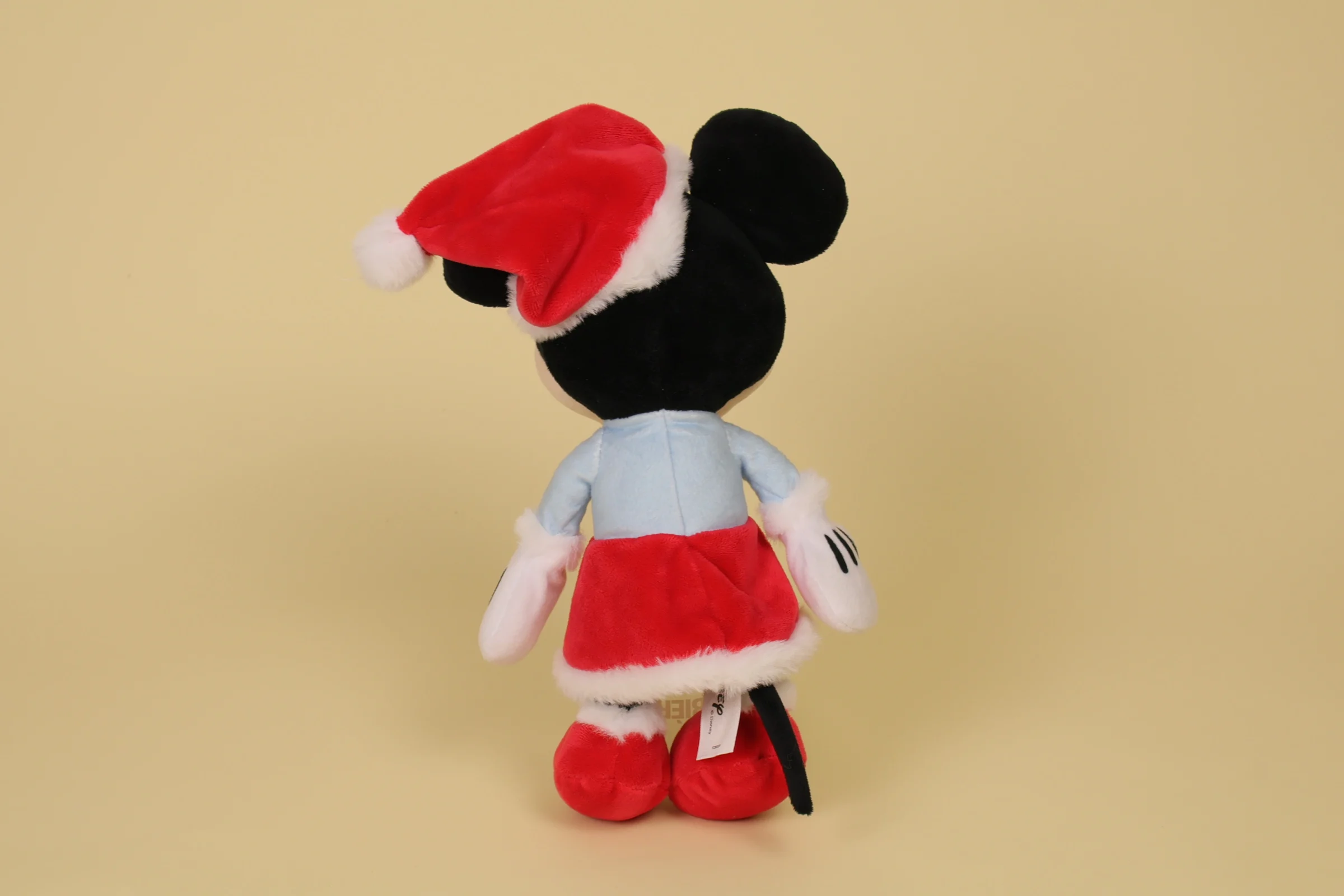 Dos Peluche Minnie Mouse 30 cm robe bleue et rouge bonnet de Noël marque Disney doudou officiel