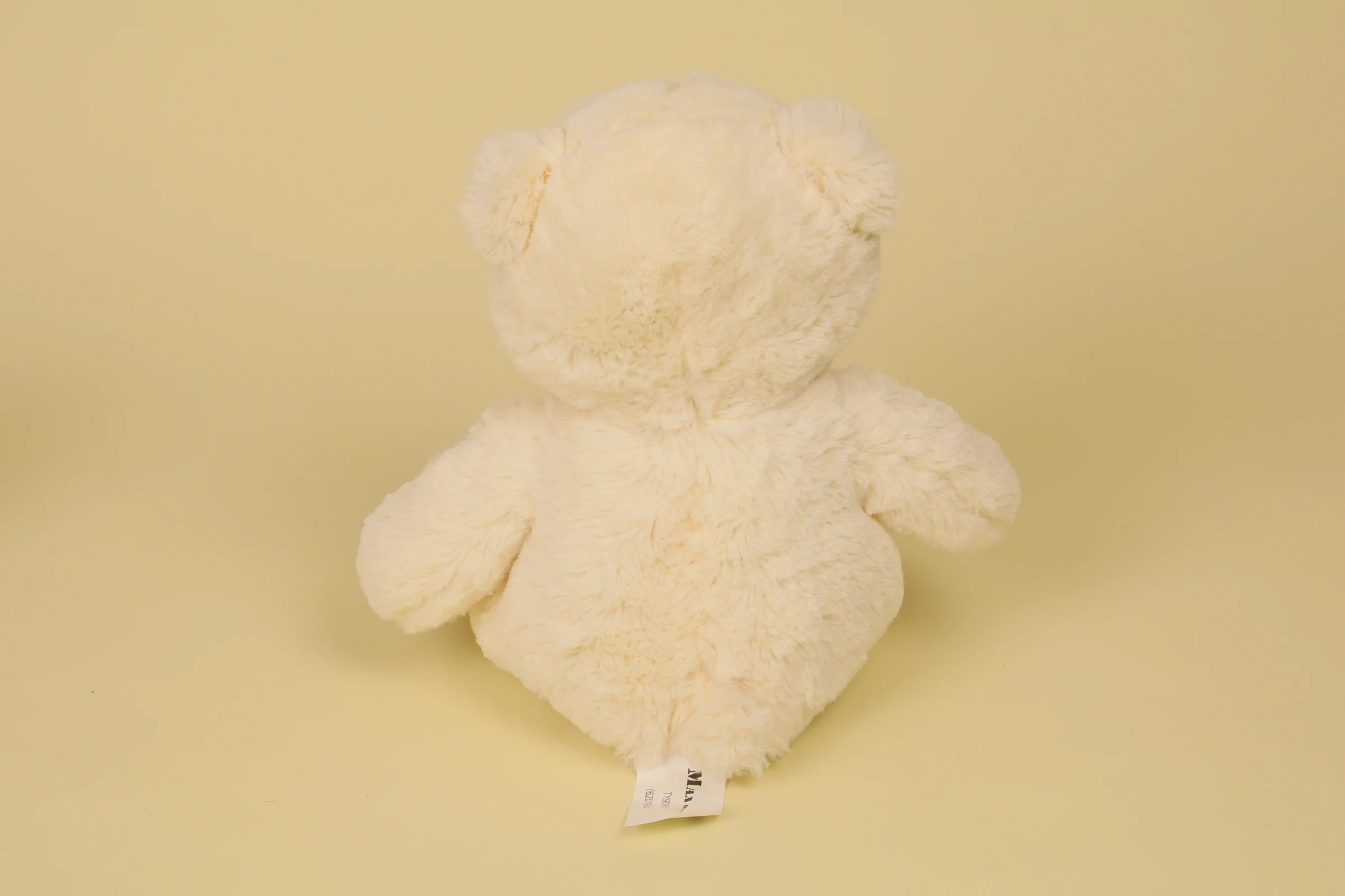 Dos Peluche ours blanc 29 cm avec nœud marron à pois marque Max & Sax doudou classique doux