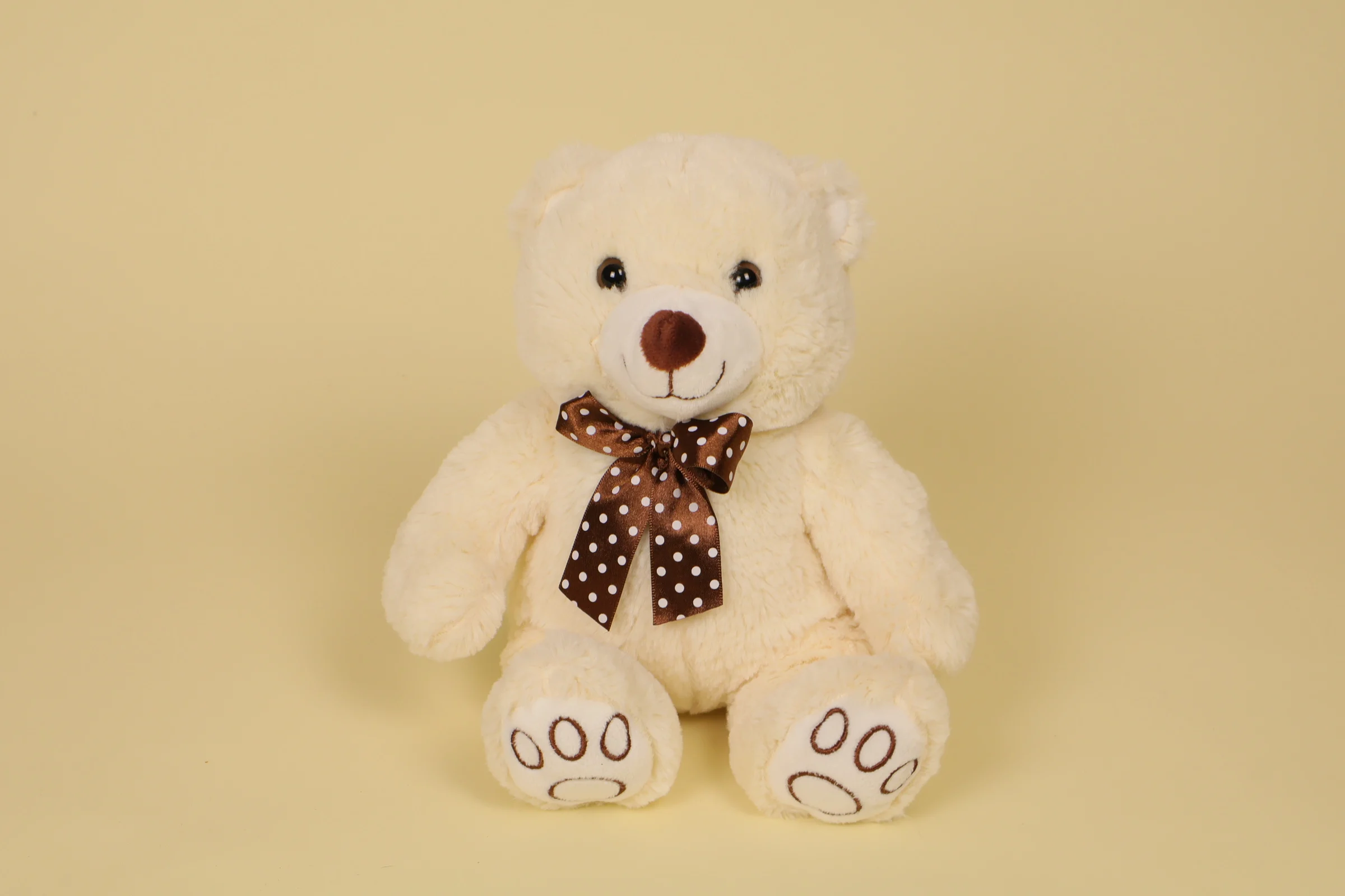 Peluche ours blanc 29 cm avec nœud marron à pois marque Max & Sax doudou classique doux