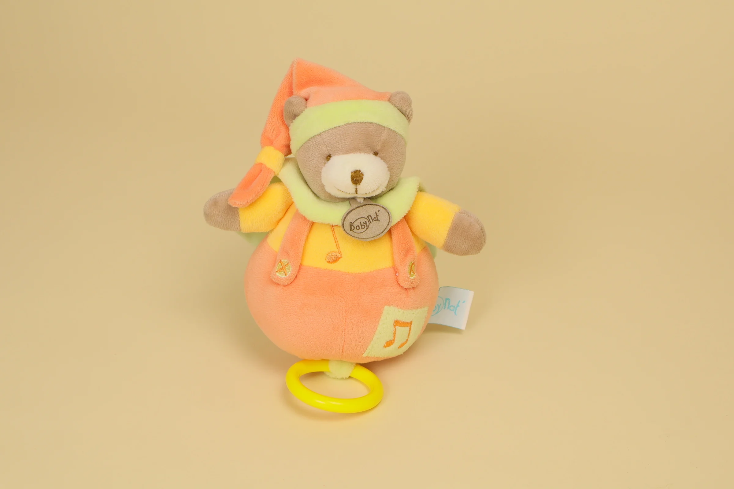 Doudou ours musical boule orange jaune et vert collection Mem' Pacap marque Baby Nat' peluche éveil