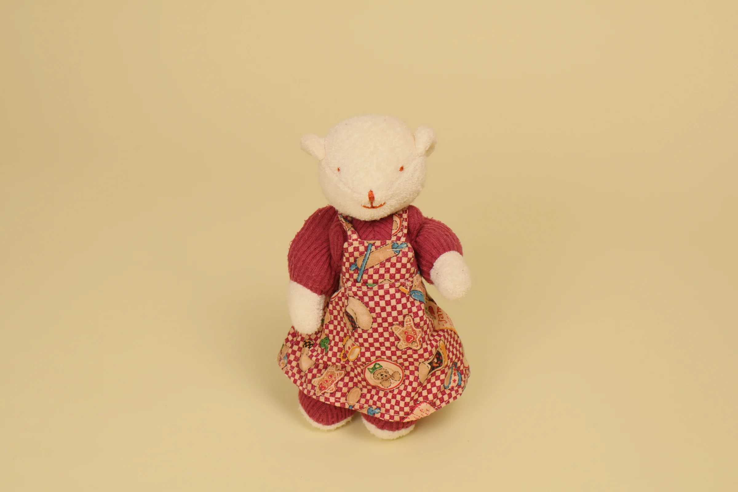 Mini peluche ours blanc vintage 19 cm collection Vite un Câlin marque Moulin Roty robe imprimée bordeaux