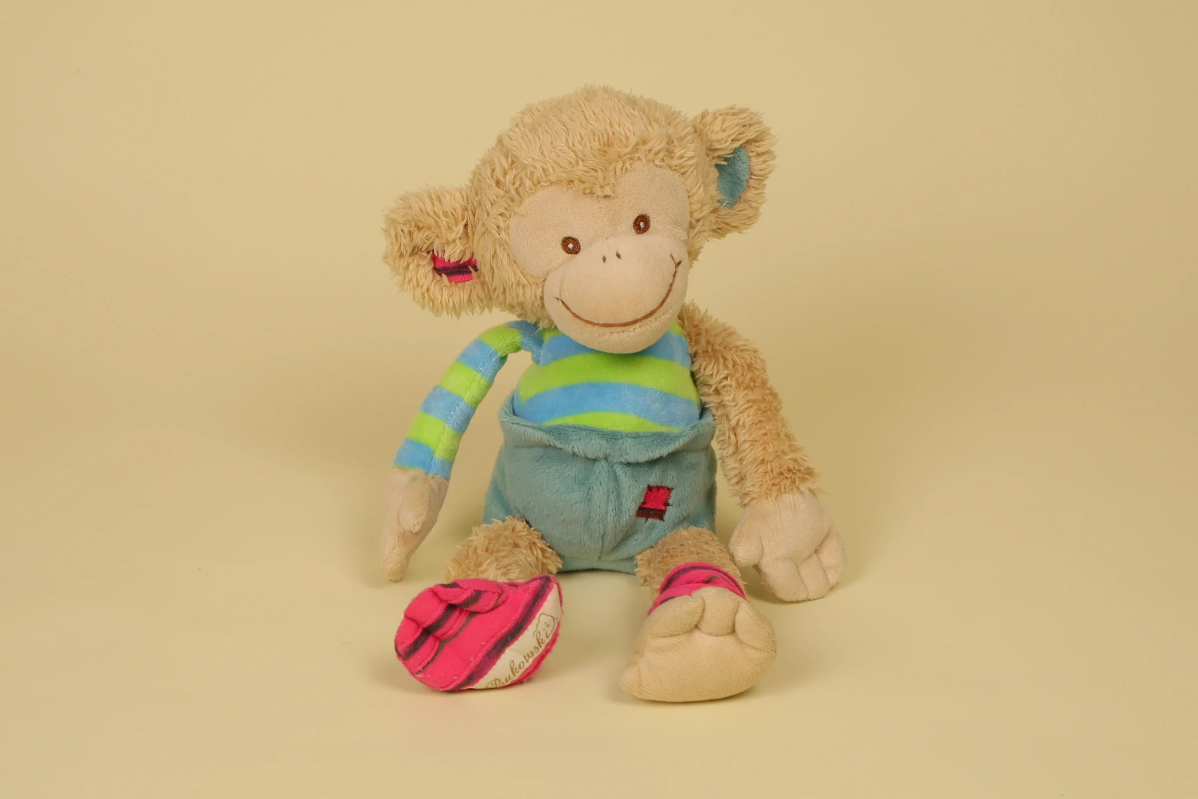 Peluche singe multicolore beige vert bleu rose 32 cm marque Bukowski Design doudou suédois