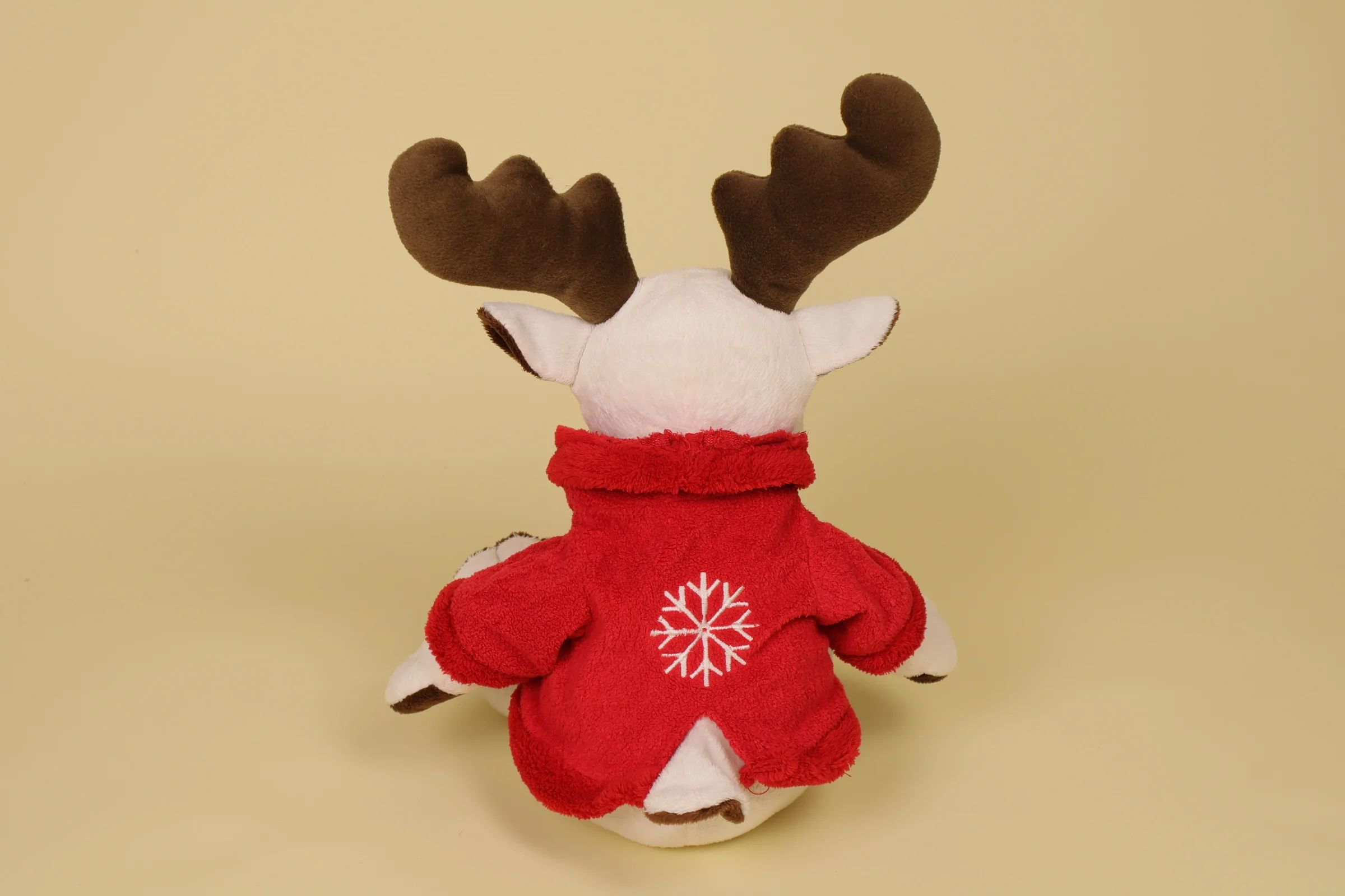 Dos Grande peluche renne 45 cm veste rouge brodée flocon blanc et marron marque CIAD décoration Noël