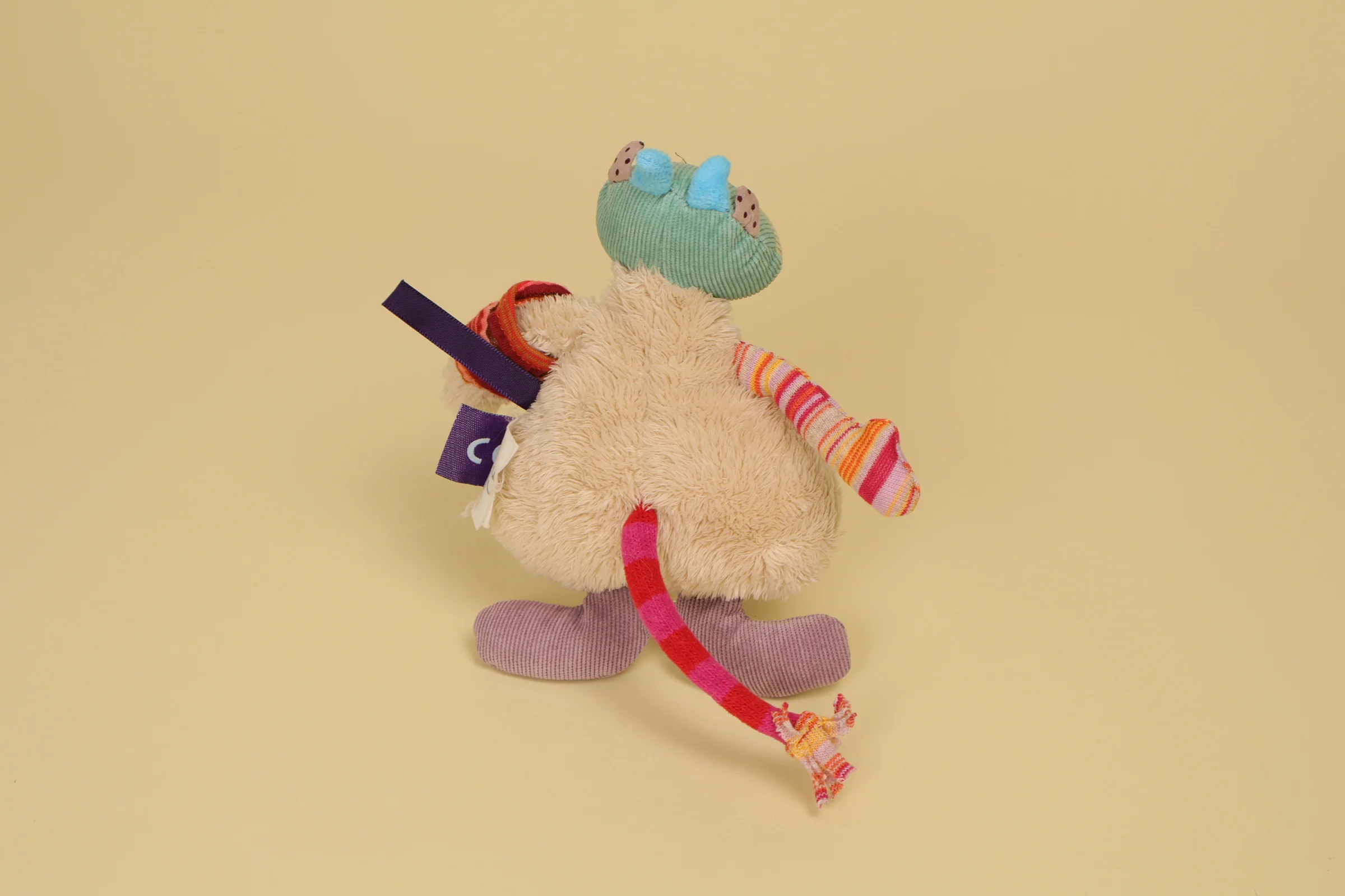 Dos Doudou vache semi-plat multicolore 18 cm collection Les Jolis Pas Beaux marque Moulin Roty multi-textures
