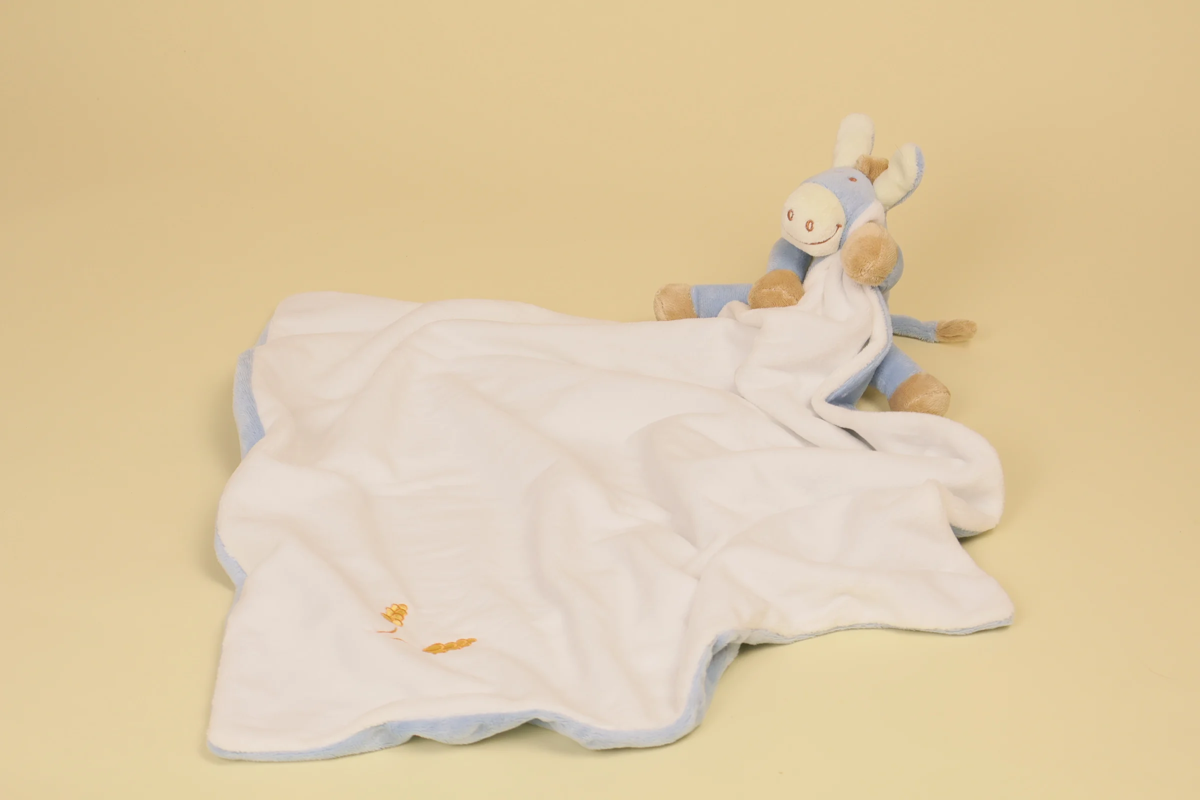 ouvert Doudou âne Paco avec couverture bleue et blanche épi de blé brodé marque Noukie's collection Paco Veloudoux