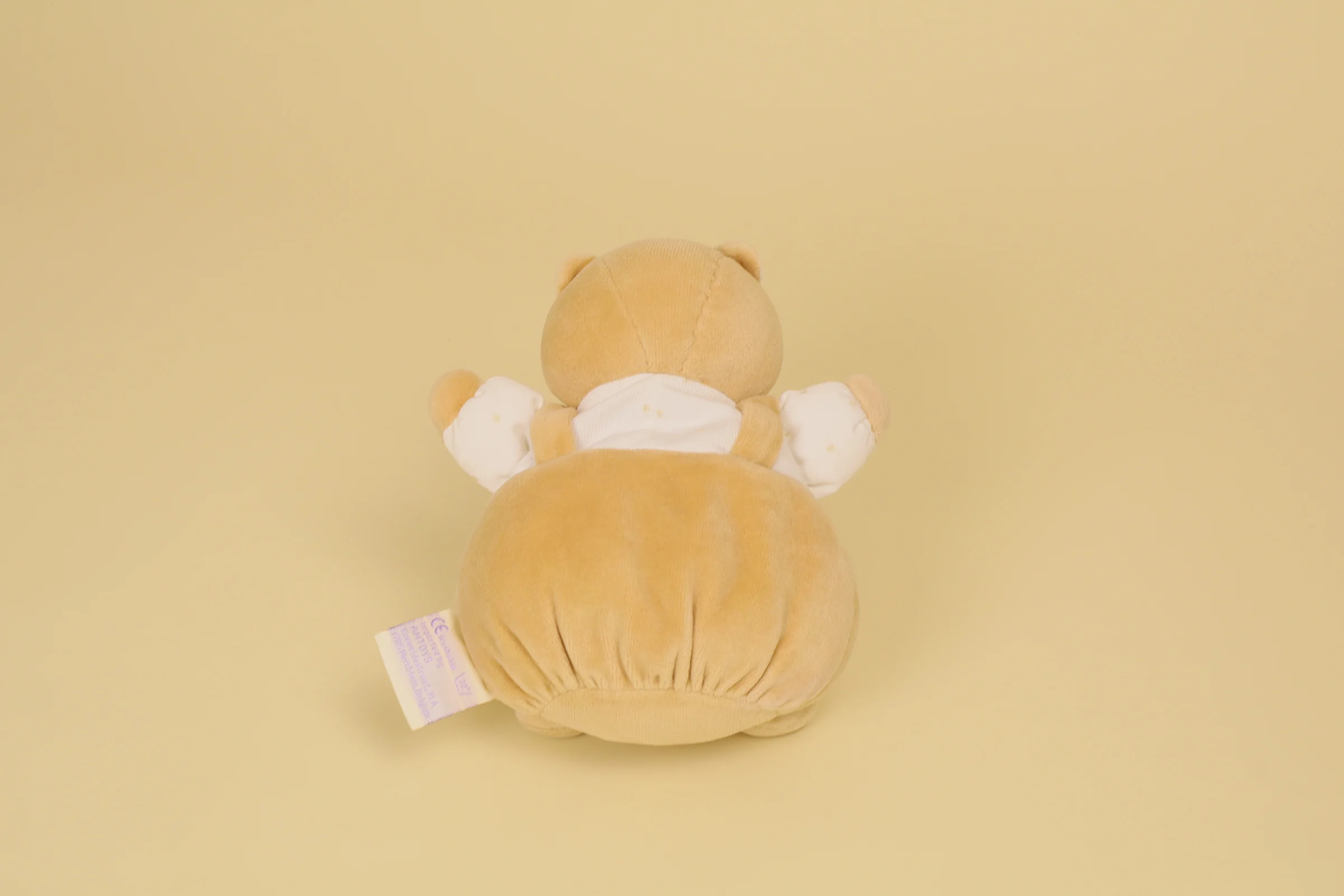 dos Doudou ours boule beige blanc salopette bruit grelot 19 cm marque Noukie's Veloudoux naissance