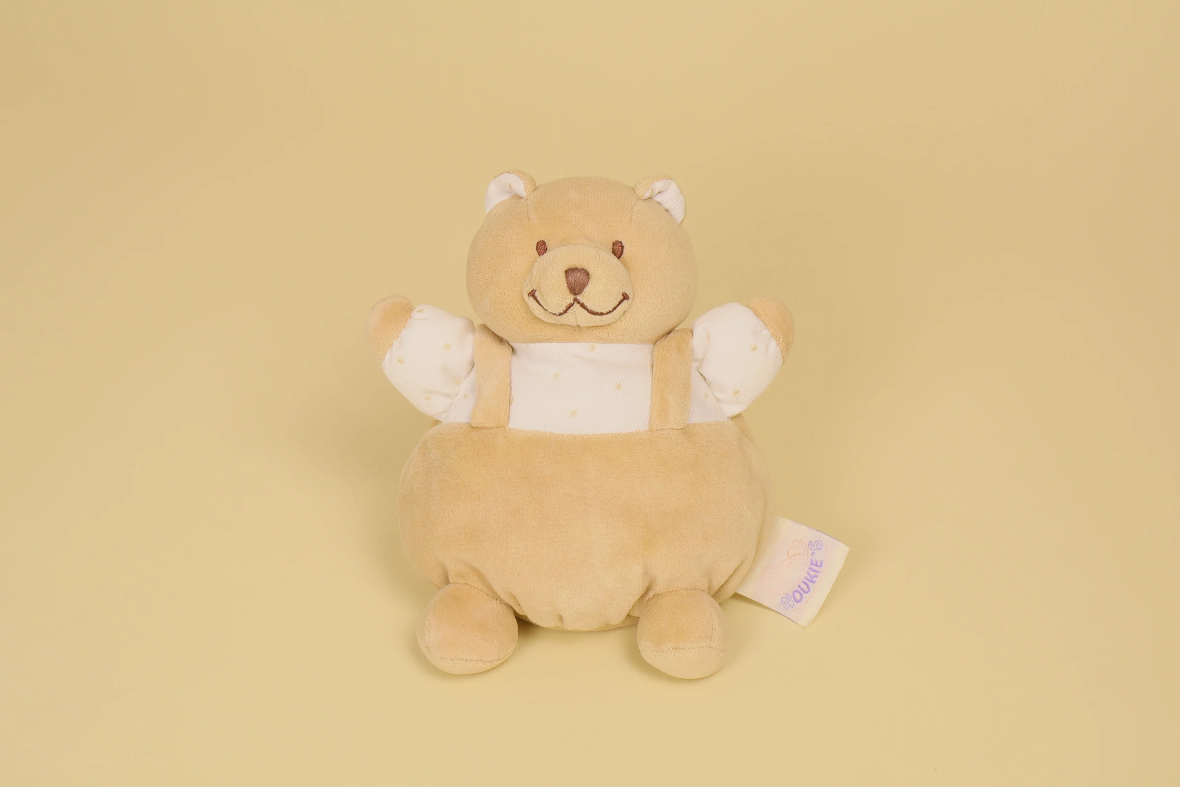 Doudou ours boule beige blanc salopette bruit grelot 19 cm marque Noukie's Veloudoux naissance