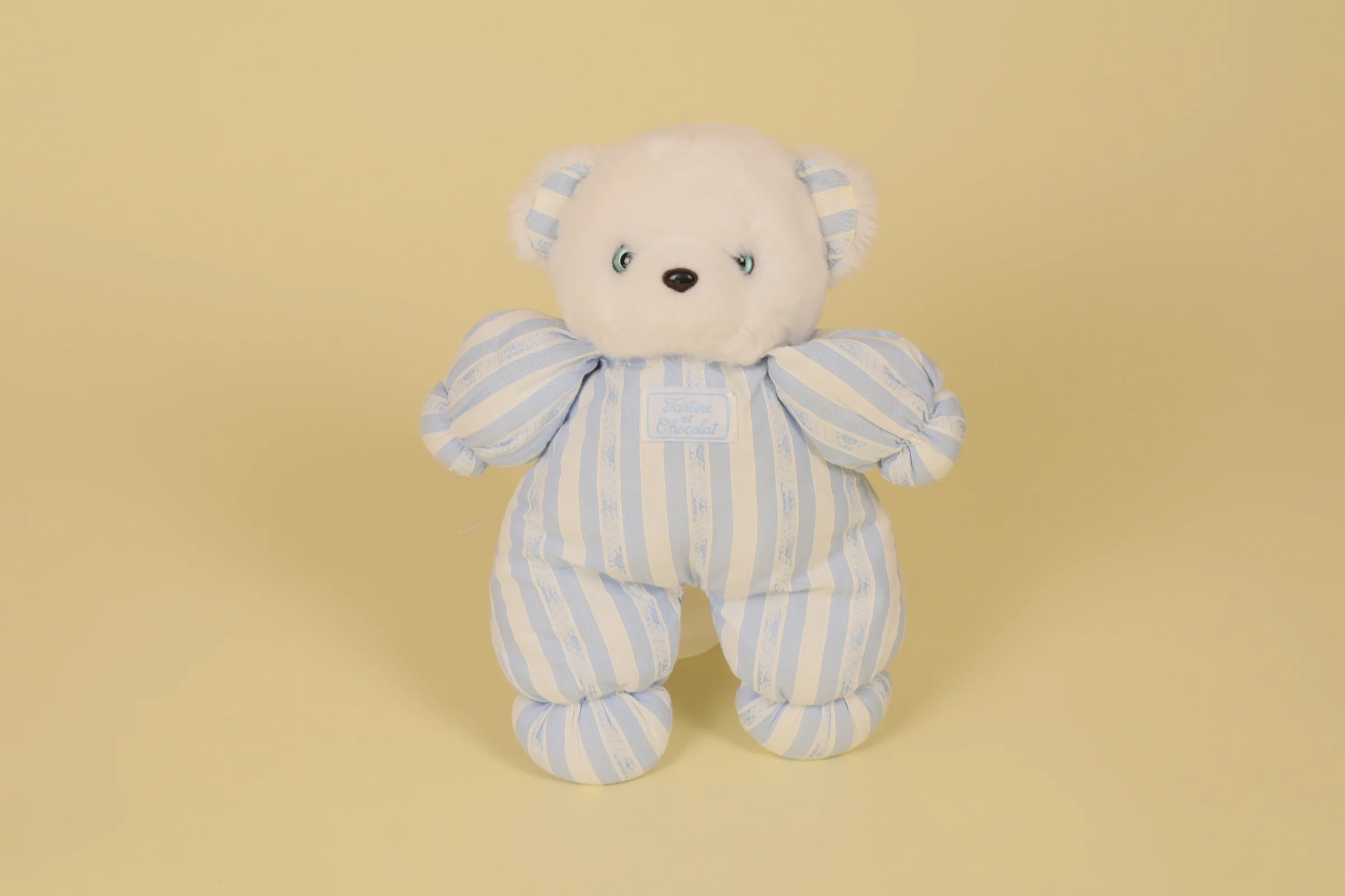 Peluche ours blanc et rayé bleu yeux billes bleus et noirs marque Tartine et Chocolat 24 cm