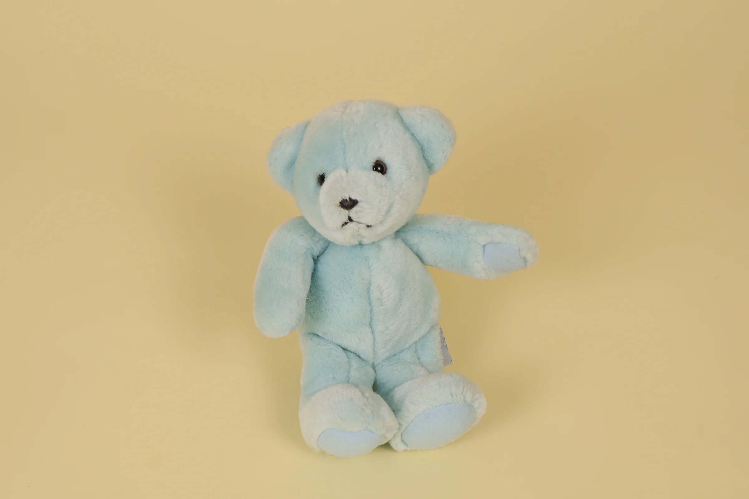 Petite peluche ours bleu clair yeux billes marque Nounours 20 cm style classique
