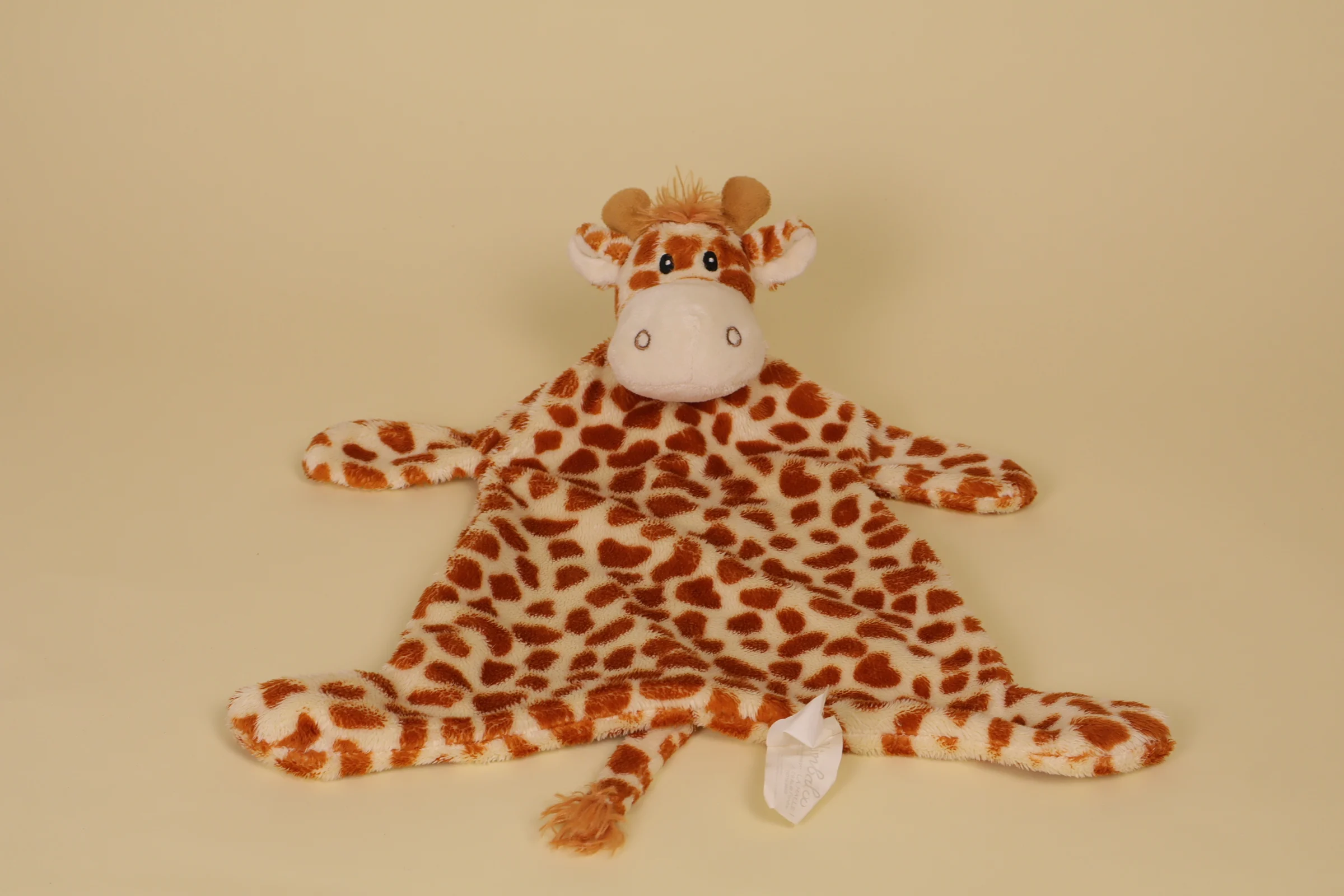 Grand doudou plat girafe de couleur marron et beige de la marque Kimbaloo