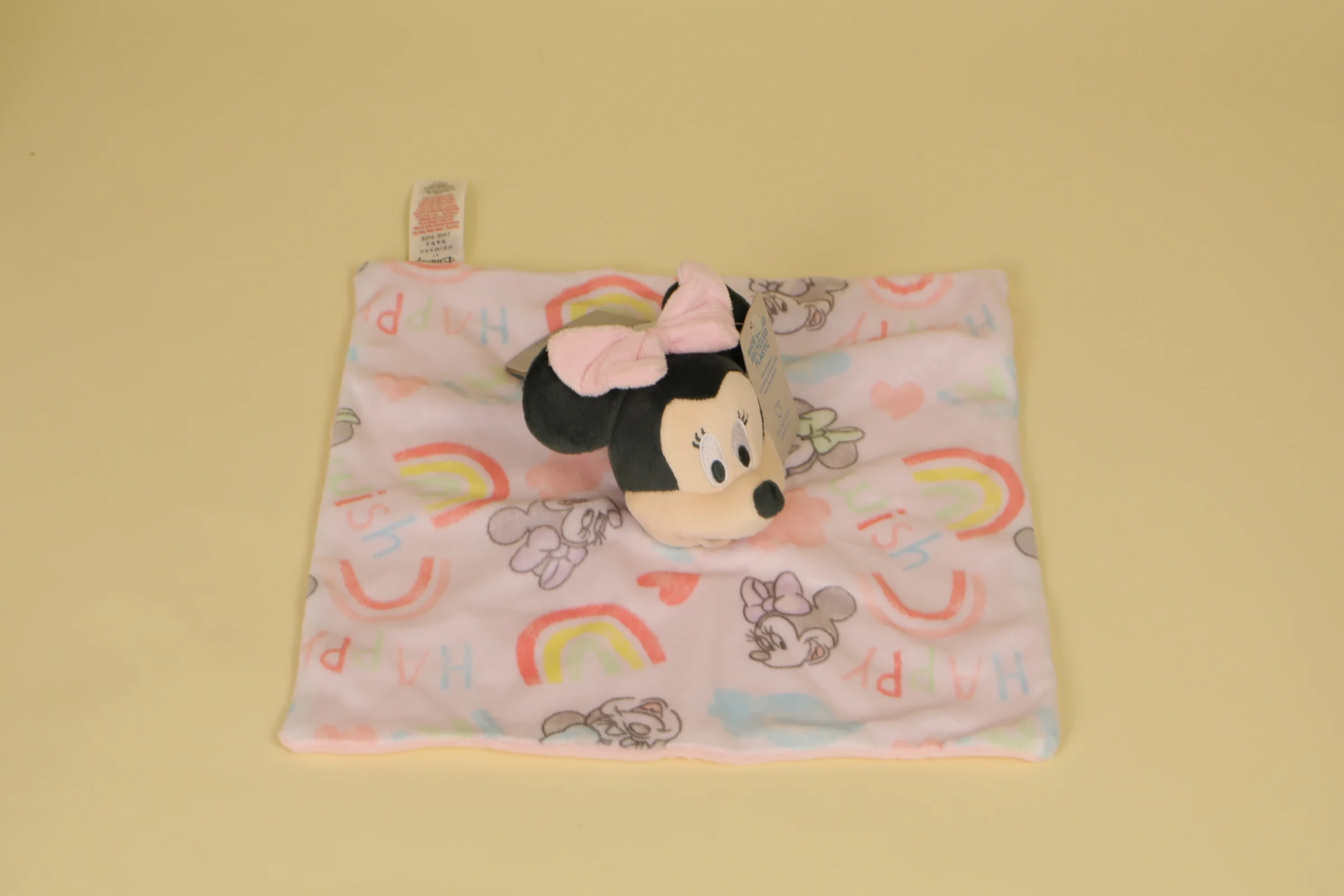 Doudou Minnie plat avec imprimes arcs-en-ciel nuages coeurs et verso rose edition 2021 marque Primark Disney