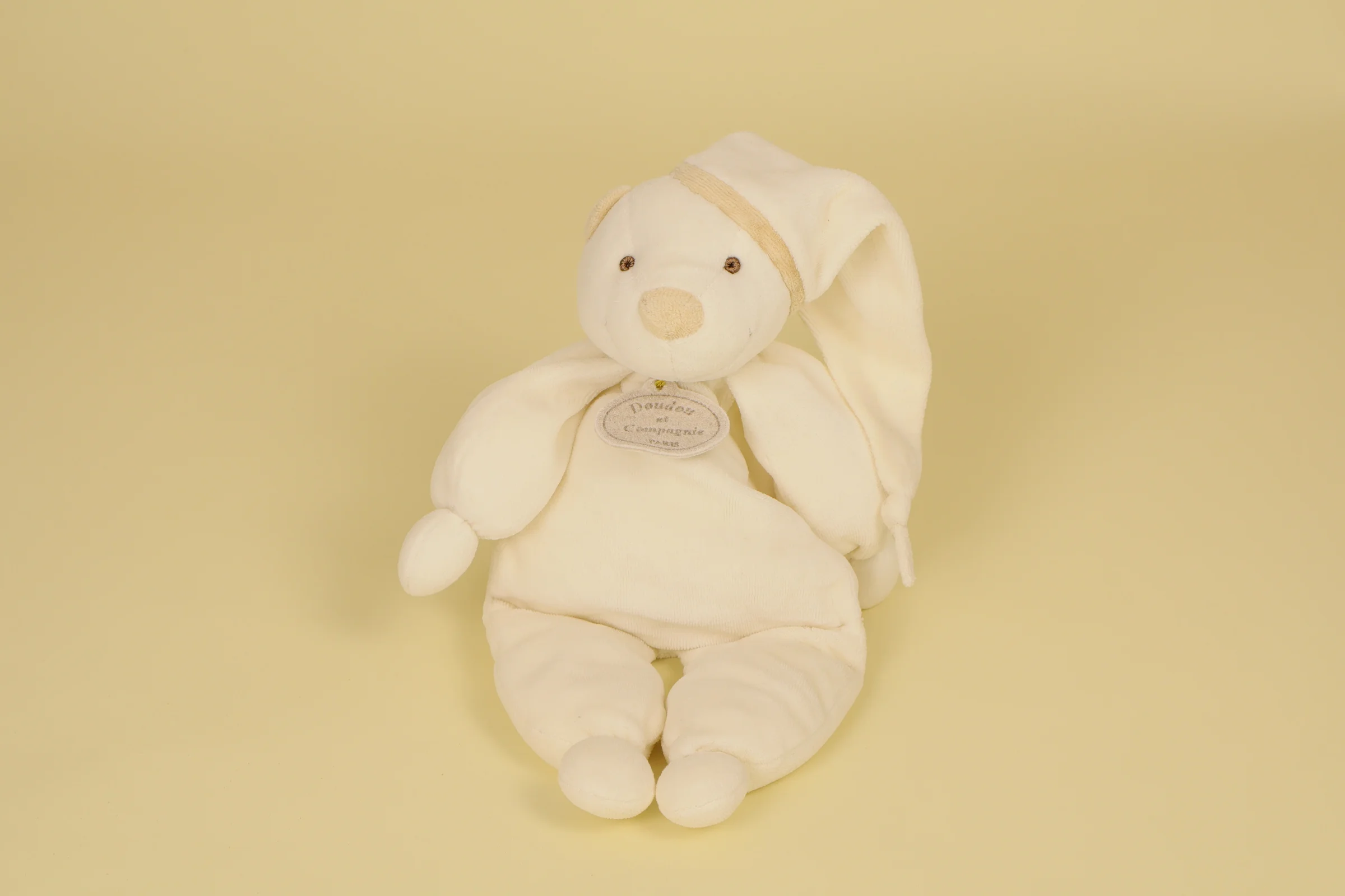 Doudou Ours pantin Fripon blanc avec bonnet de nuit et salopette beige lesté aux fesses 32 cm collection 2000 marque Doudou et Compagnie